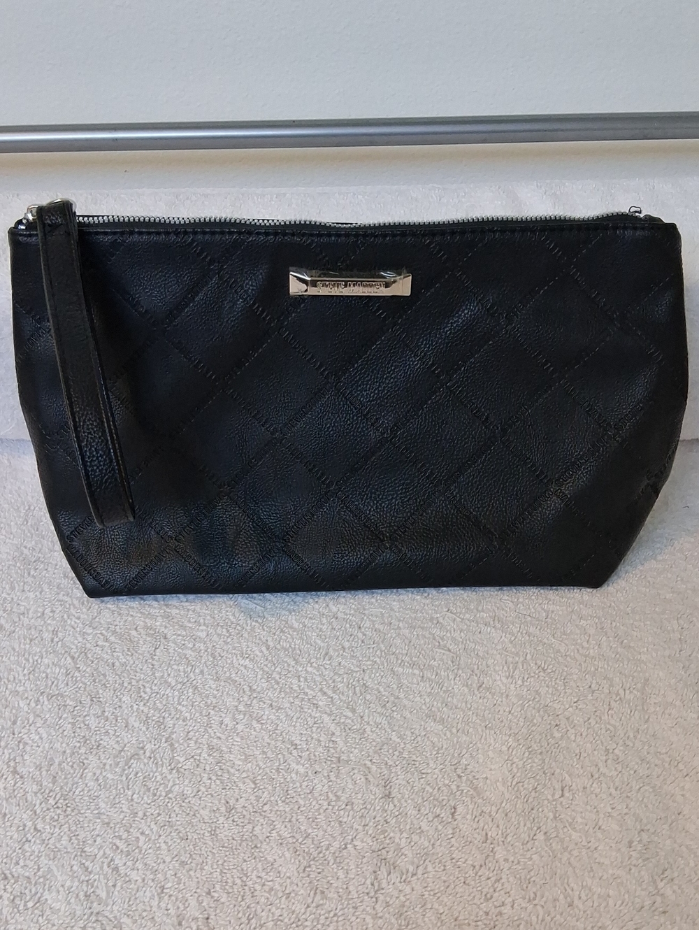 This Is A Black Logo Embossed Steve Madden Pouch